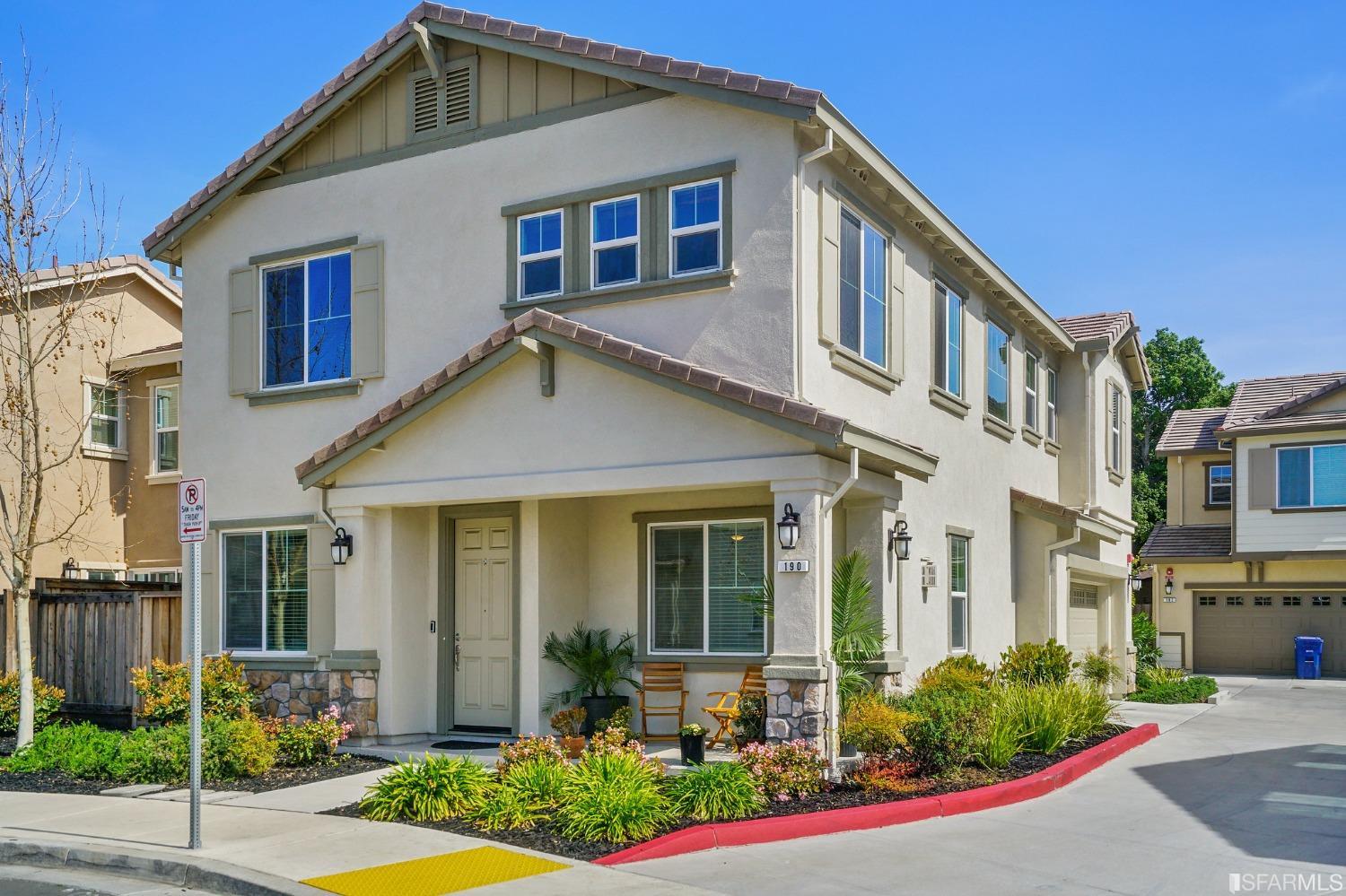 a front view of a house with garden