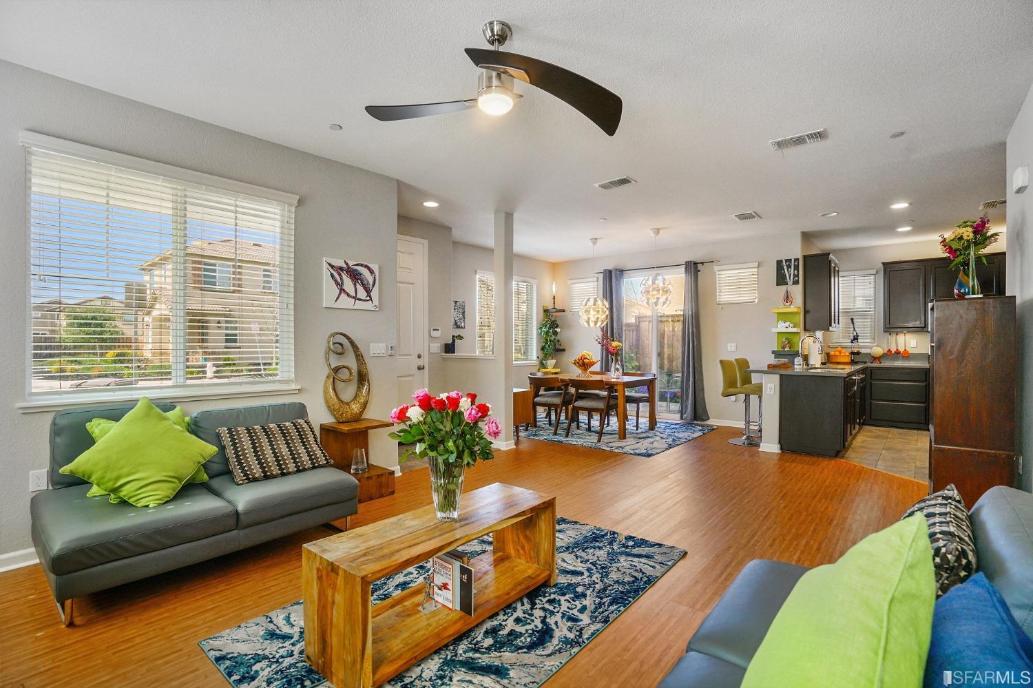 190 Belle Harbor Circle Pittsburg, CA 94565 - Photo 7 of 37 a living room with furniture kitchen and a chandelier