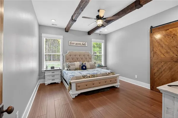 a bathroom with double vanity sinks a shower a vanity and a mirror