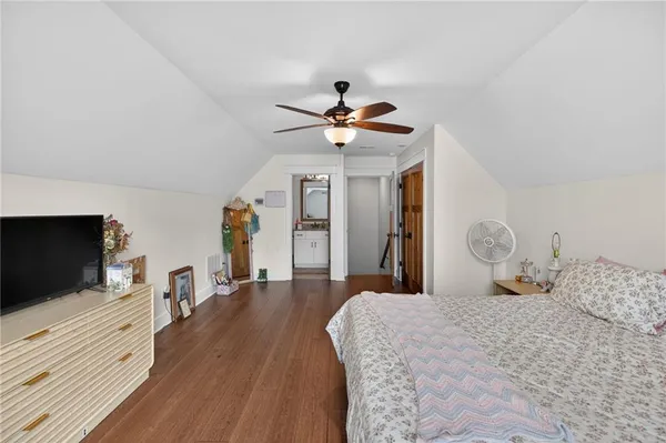an aerial view of a house with yard