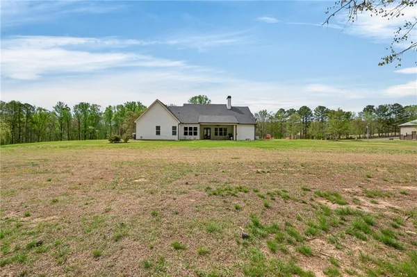 an aerial view of a house with a garden