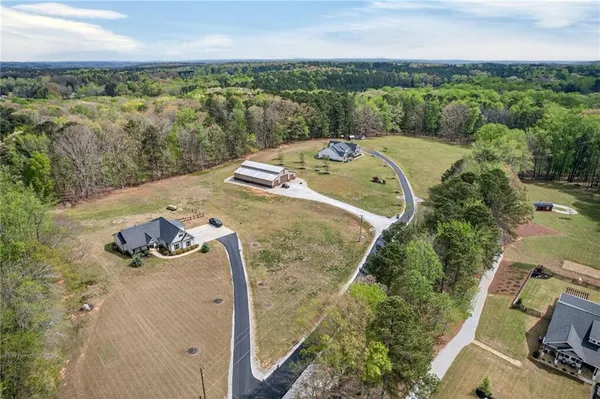a view of a house with backyard porch and sitting area