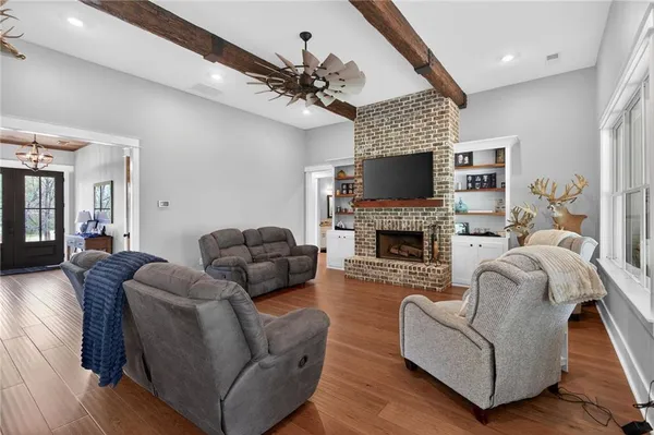 a kitchen with lots of counter top space a sink appliances and cabinets