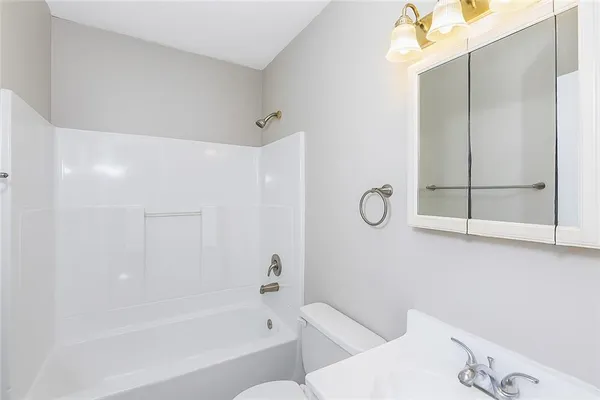 a bathroom with a bathtub a sink and a toilet