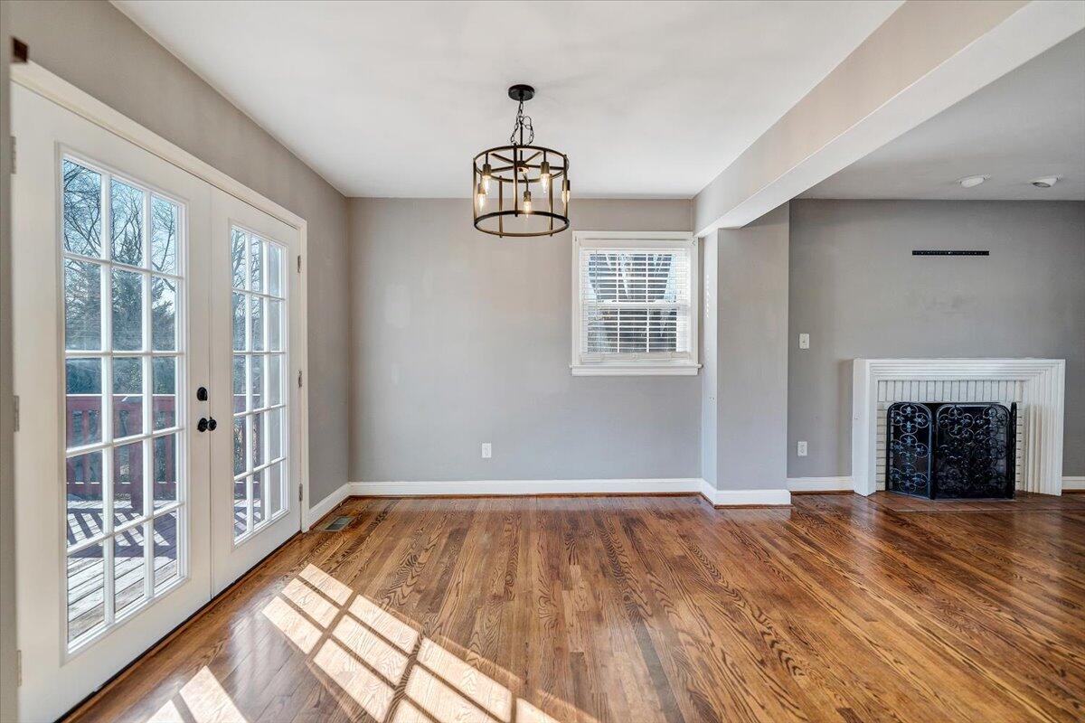 3584 Cedar Lane Roanoke, VA 24018 - Photo 13 of 75 a view of an empty room with window wooden floor and fire place