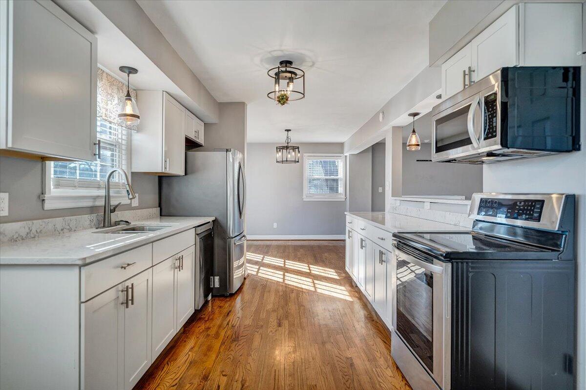 3584 Cedar Lane Roanoke, VA 24018 - Photo 22 of 75 a kitchen with stainless steel appliances granite countertop a sink stove and refrigerator