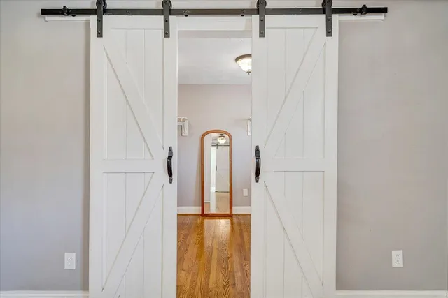 a bathroom with a toilet a sink a vanity and mirror