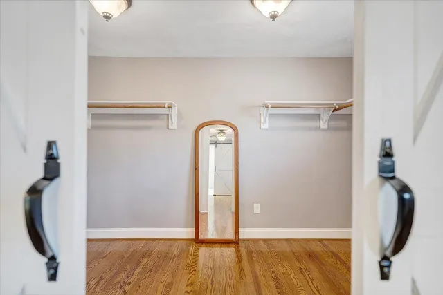 a bathroom with a bathtub and window