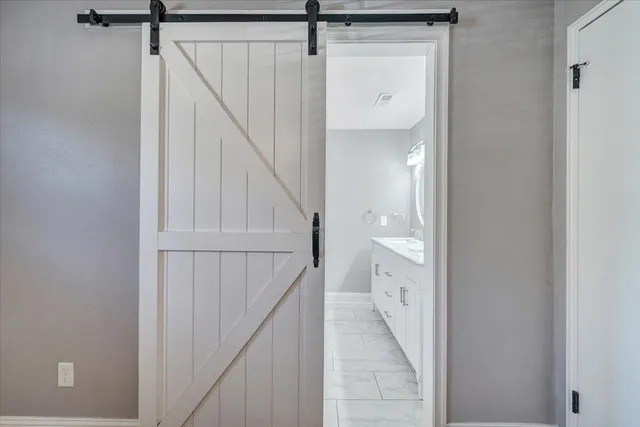 a view of empty room with wooden floor and fireplace