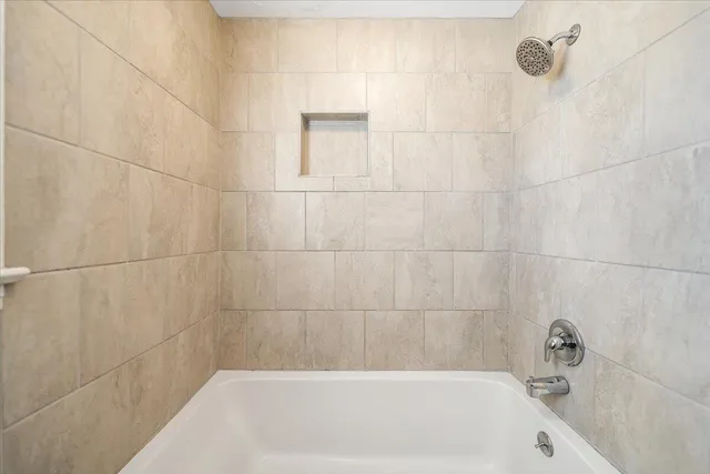 a view of a house with a yard covered with snow