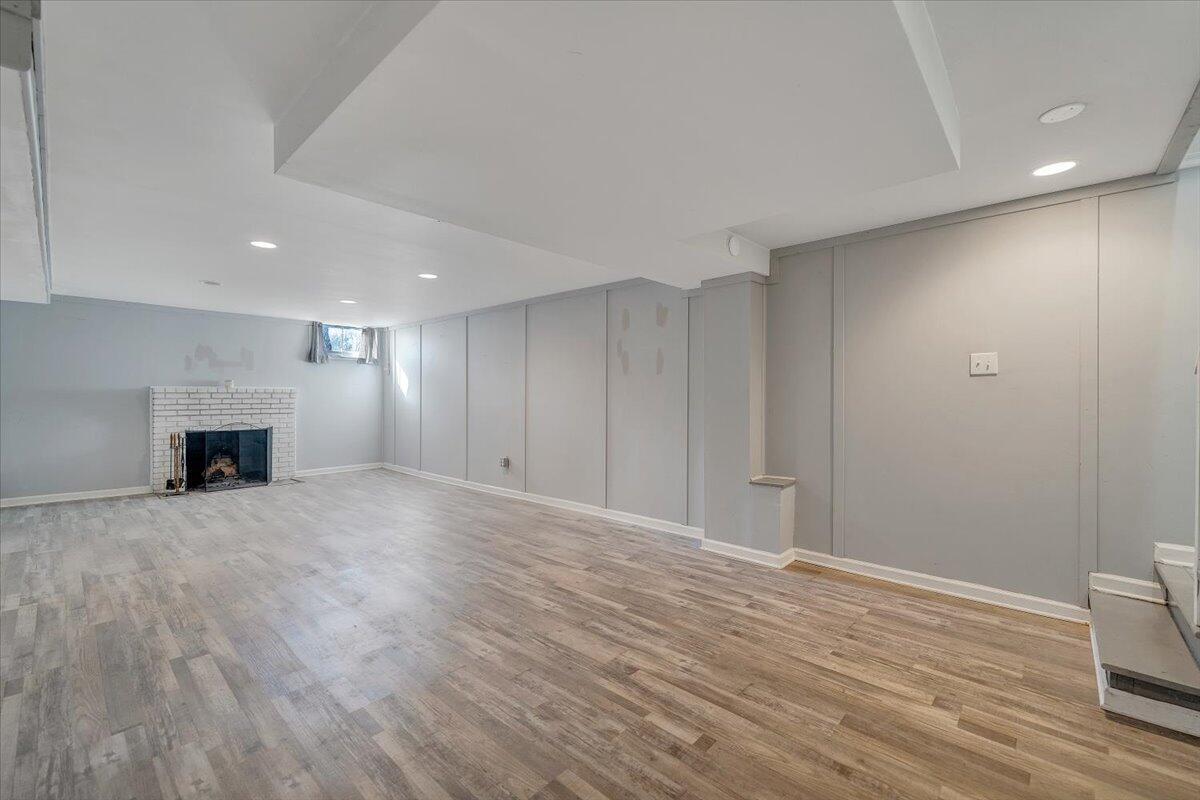 3584 Cedar Lane Roanoke, VA 24018 - Photo 49 of 75 a view of empty room with wooden floor and fireplace