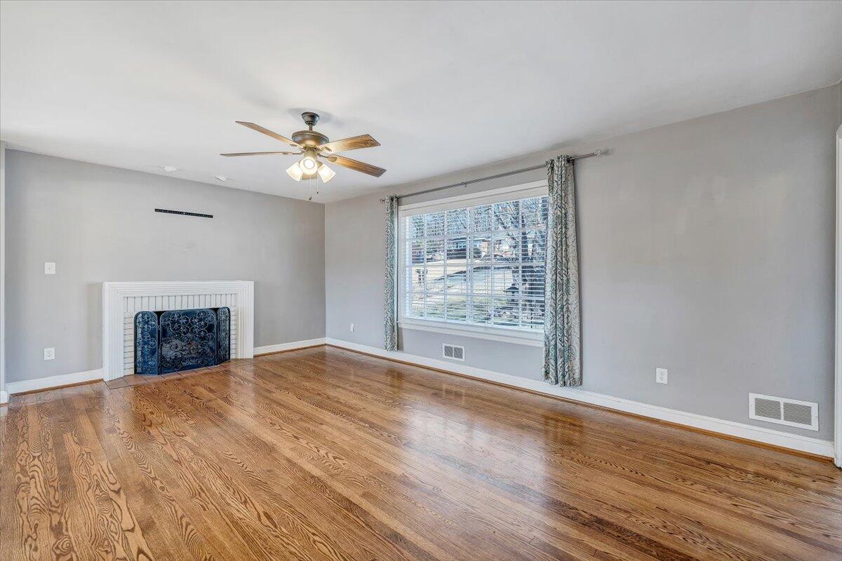 3584 Cedar Lane Roanoke, VA 24018 - Photo 6 of 75 a view of an empty room with a window and a kitchen