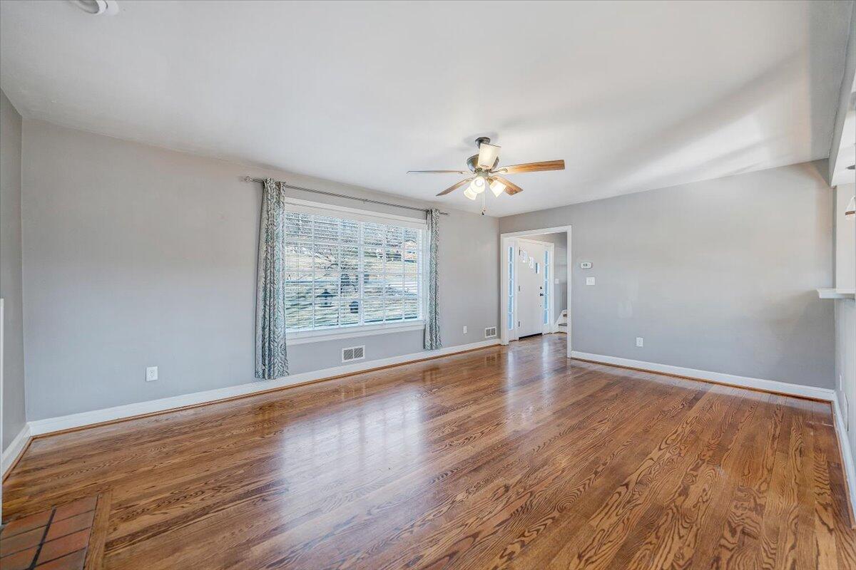 3584 Cedar Lane Roanoke, VA 24018 - Photo 7 of 75 wooden floor in an empty room with a window