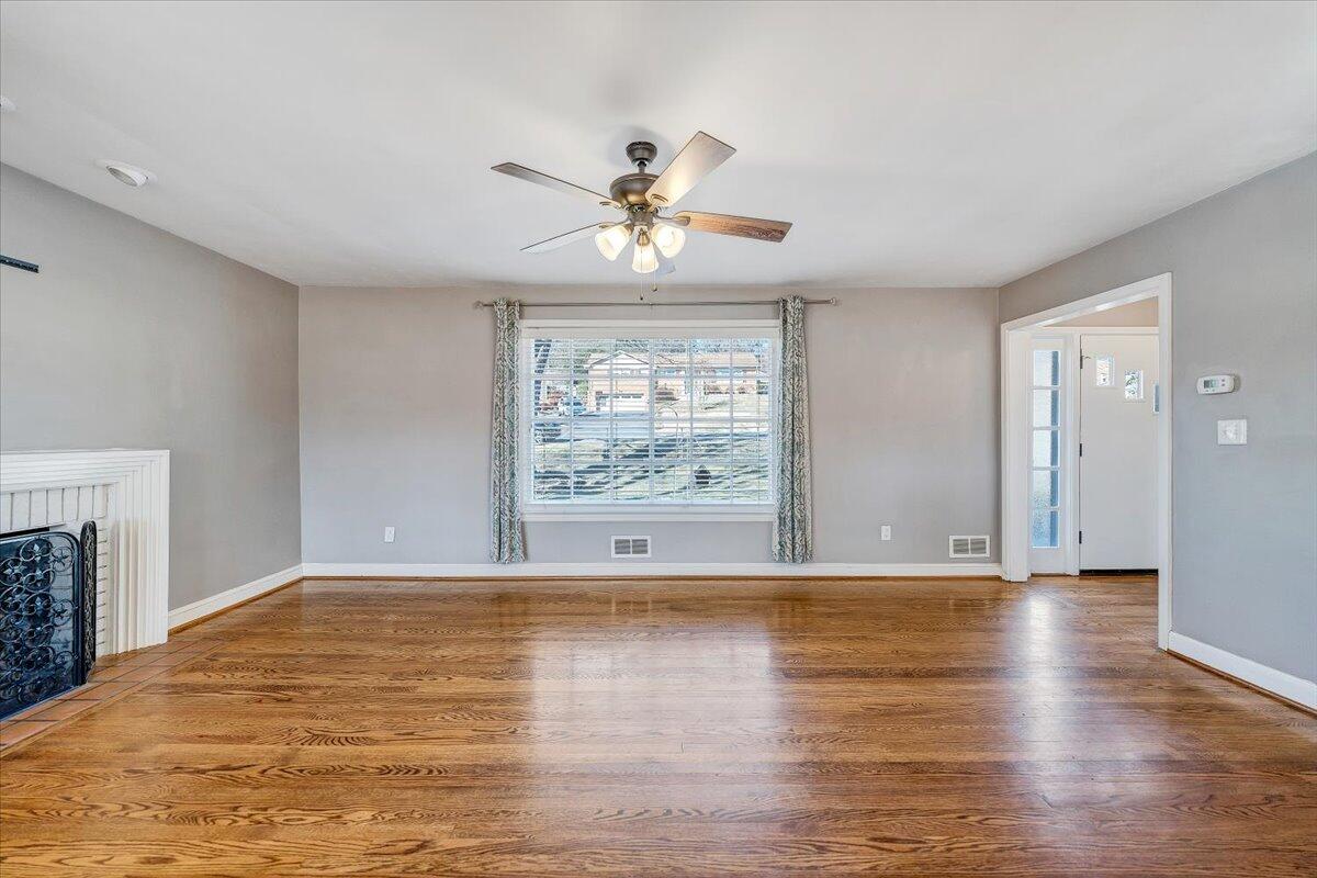 3584 Cedar Lane Roanoke, VA 24018 - Photo 8 of 75 a view of an empty room with window and wooden floor
