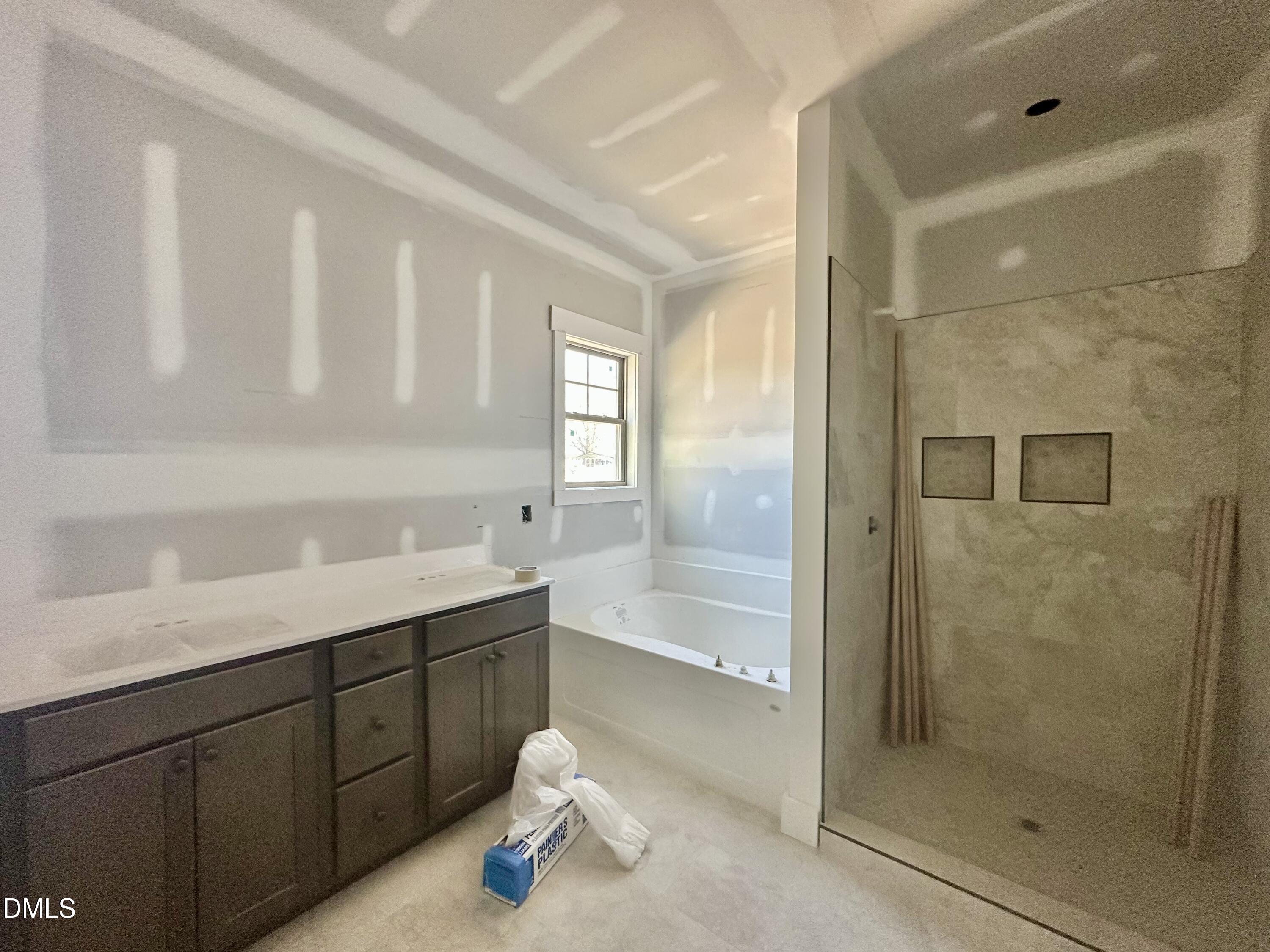 1179 Beulahtown Road Kenly, NC 27542 - Photo 12 of 26 a bathroom with a shower sink and mirror