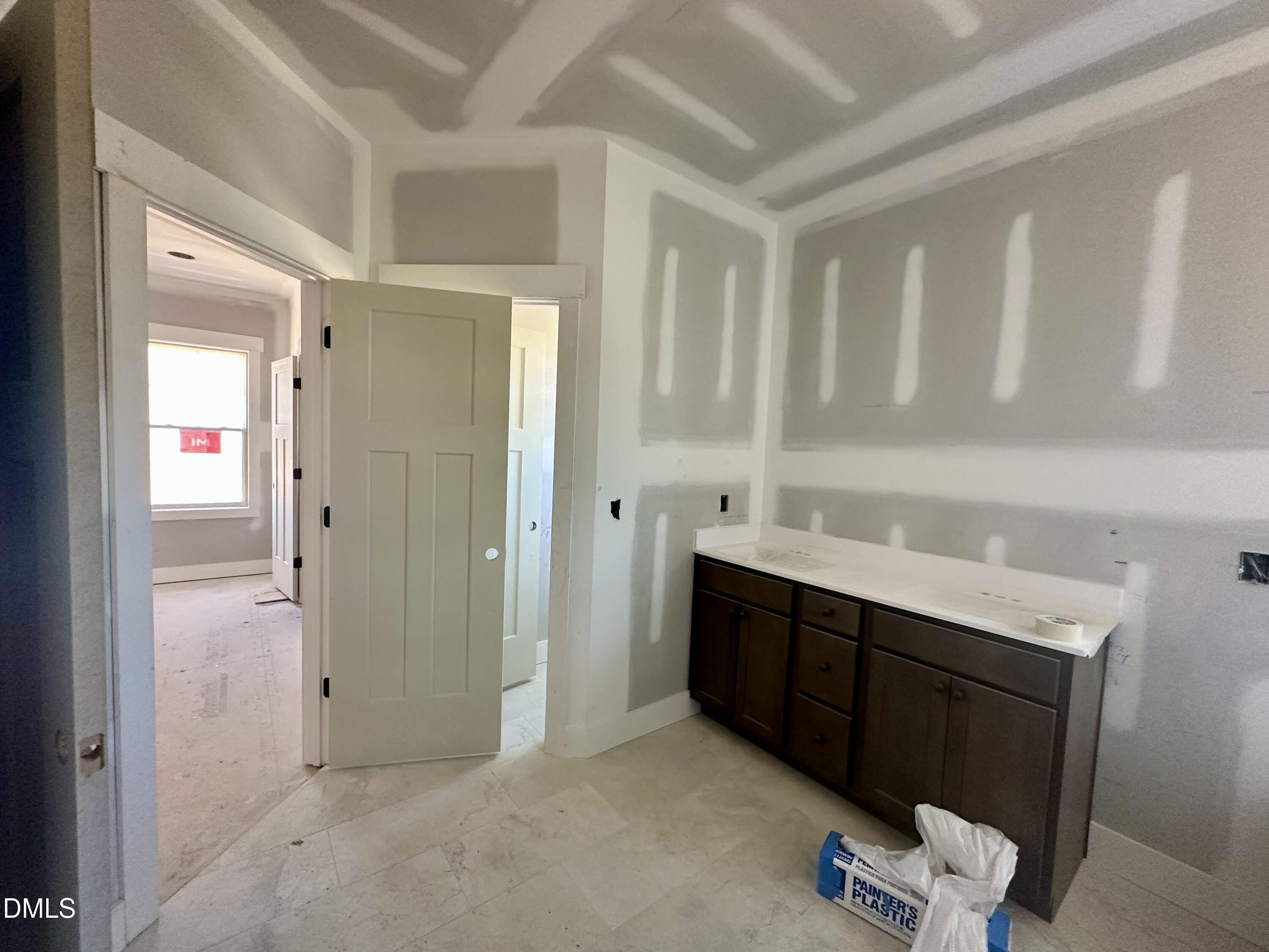 1179 Beulahtown Road Kenly, NC 27542 - Photo 13 of 26 a view of room with cabinets and wooden floor