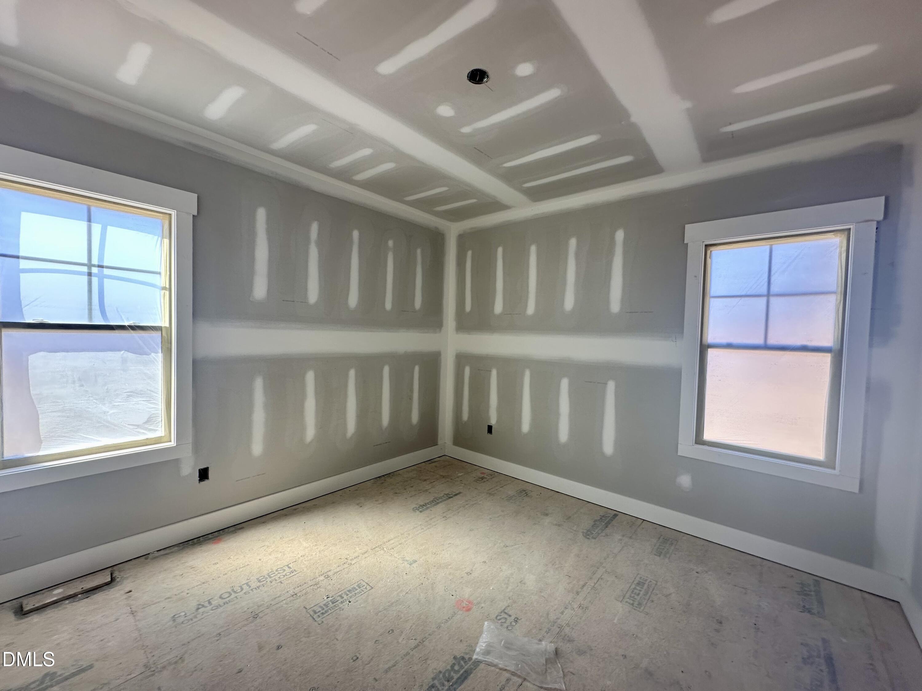 1179 Beulahtown Road Kenly, NC 27542 - Photo 16 of 26 an empty room with a empty space and windows