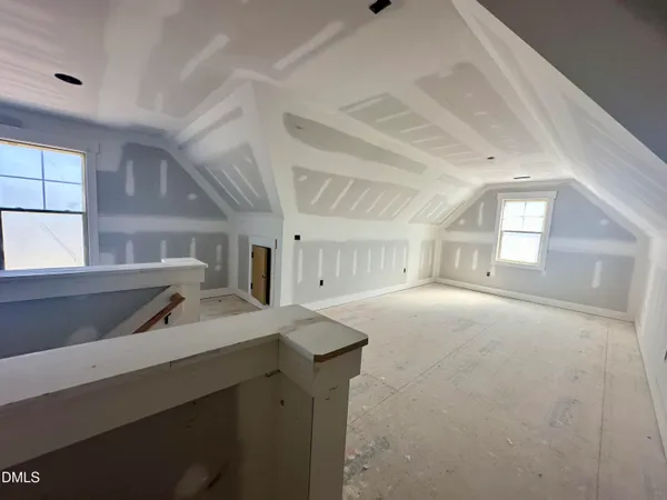 a living room with kitchen furniture and a window