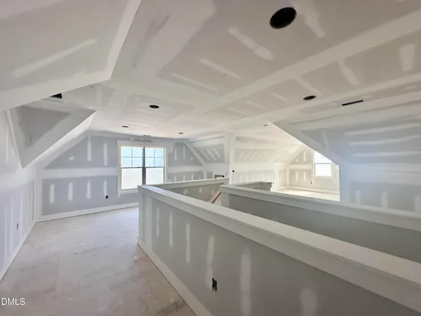a kitchen with stainless steel appliances a sink and a large window