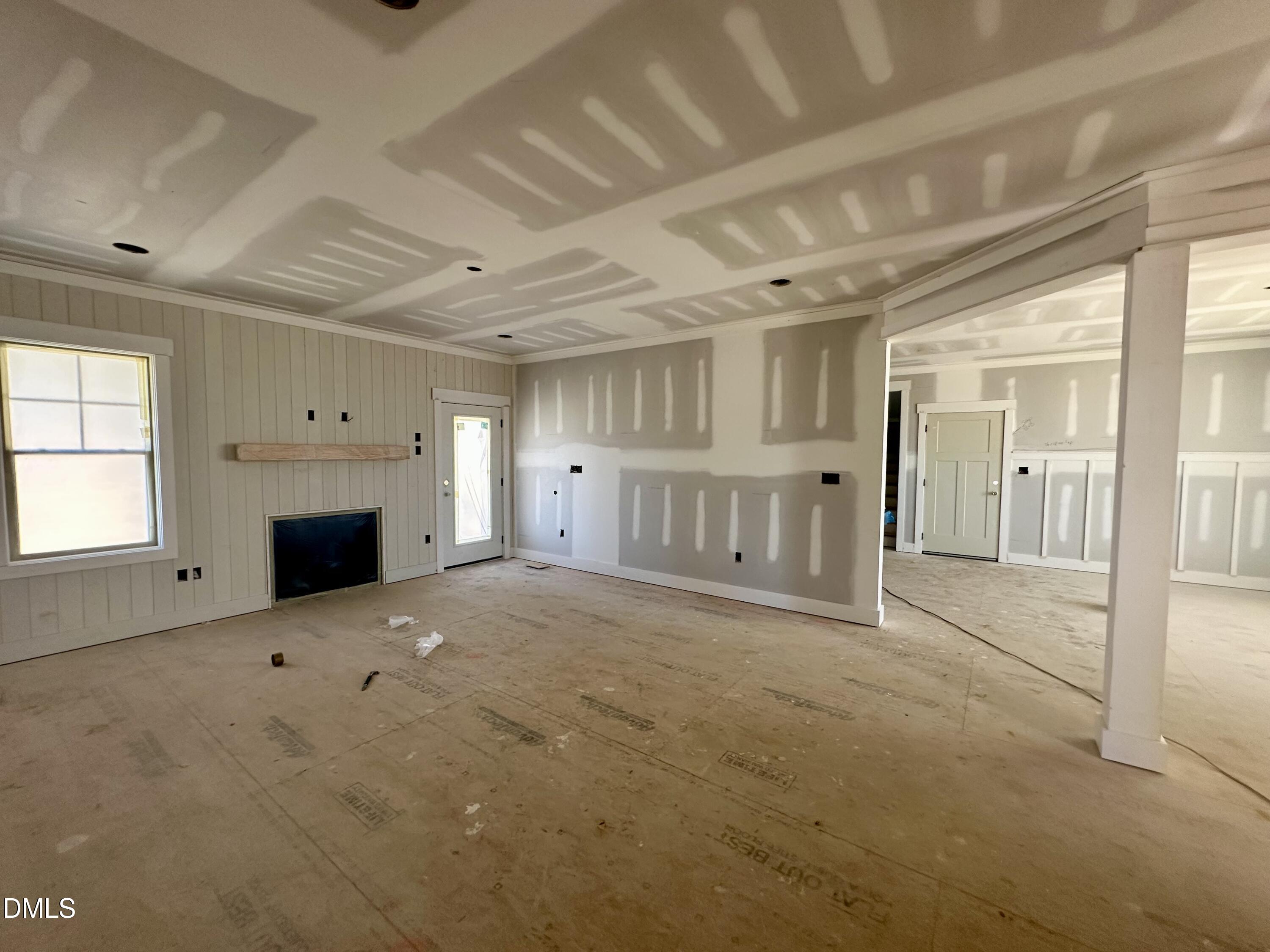 1179 Beulahtown Road Kenly, NC 27542 - Photo 6 of 26 a view of empty room with a fireplace and window