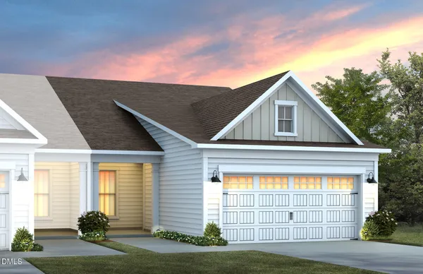a view of an house with backyard space and balcony
