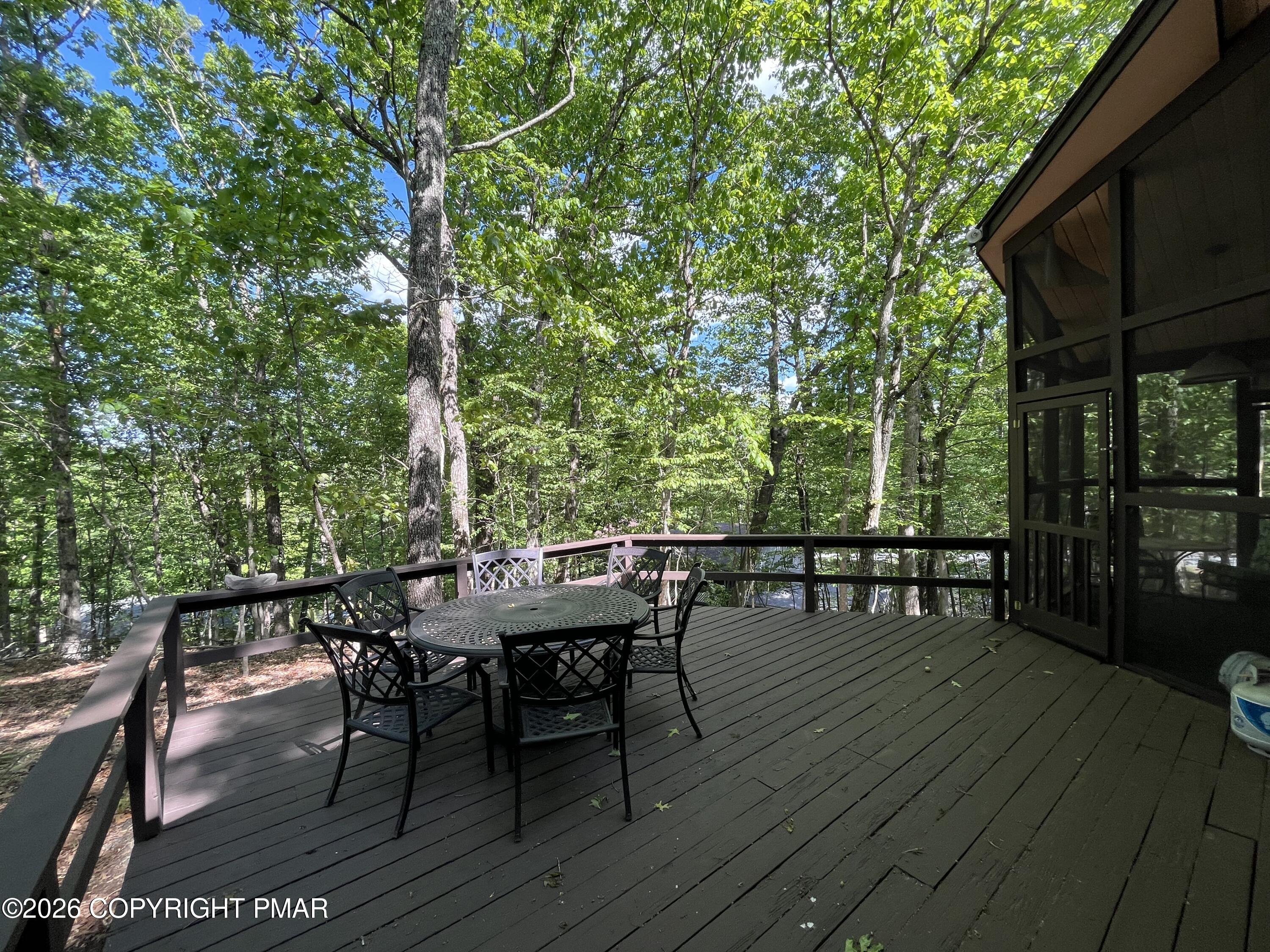 5970 Decker Road Bushkill, PA 18324 - Photo 9 of 26 a view of a dinning tables and chairs in deck