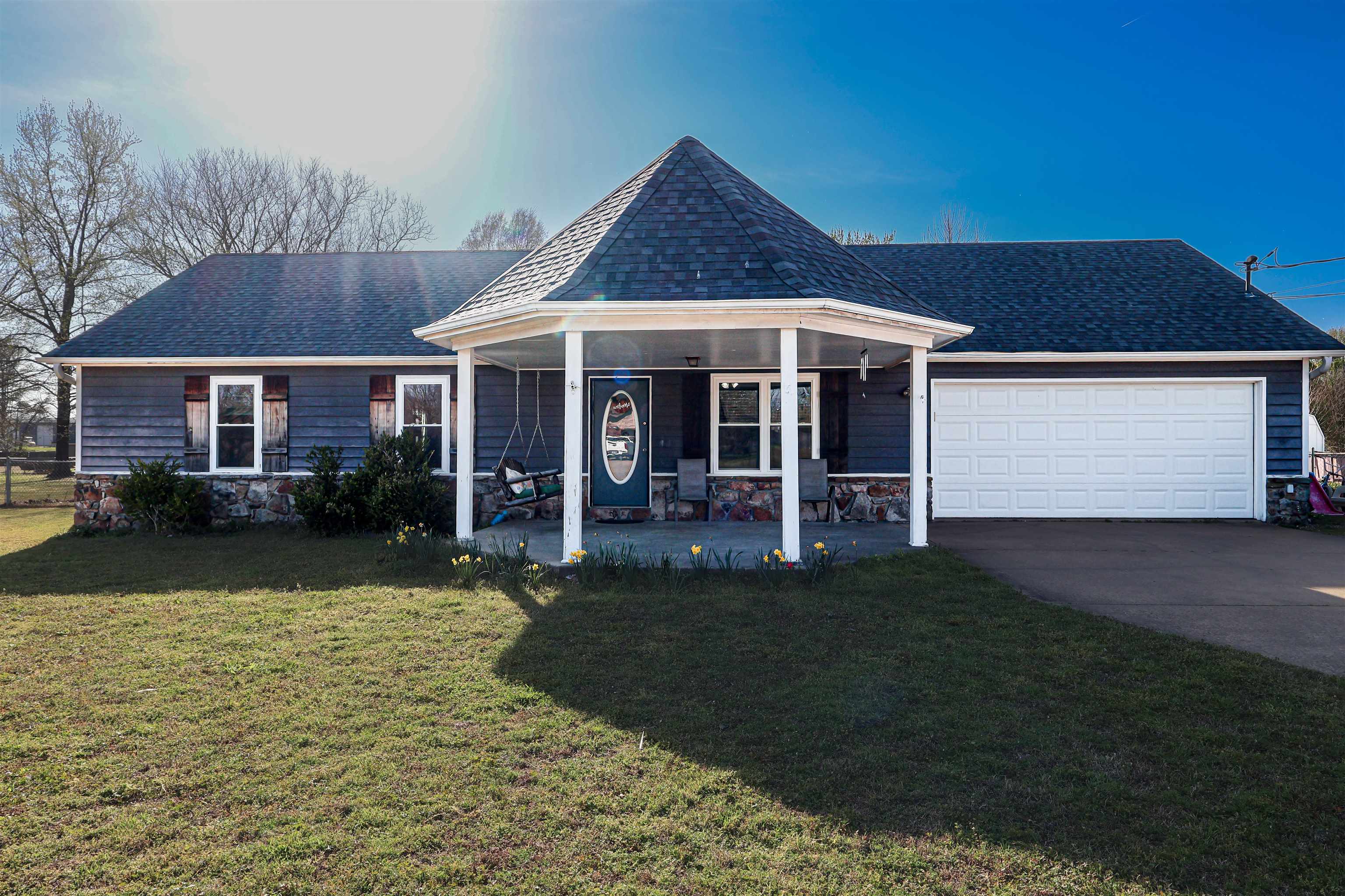 a front view of a house with garden