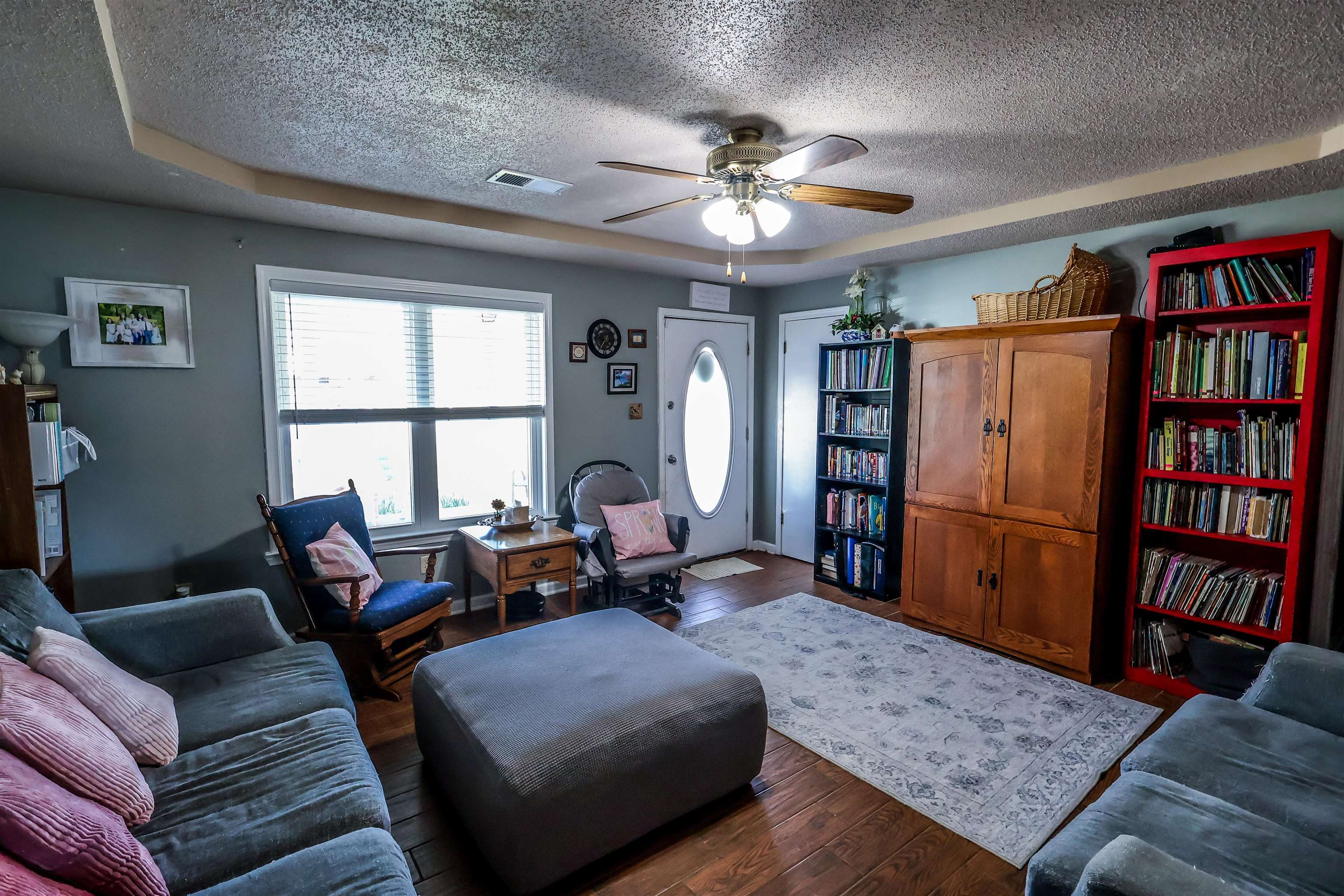 157 Nancye Reeder Avenue Munford, TN 38058 - Photo 13 of 17 a living room with furniture a window and a book shelf