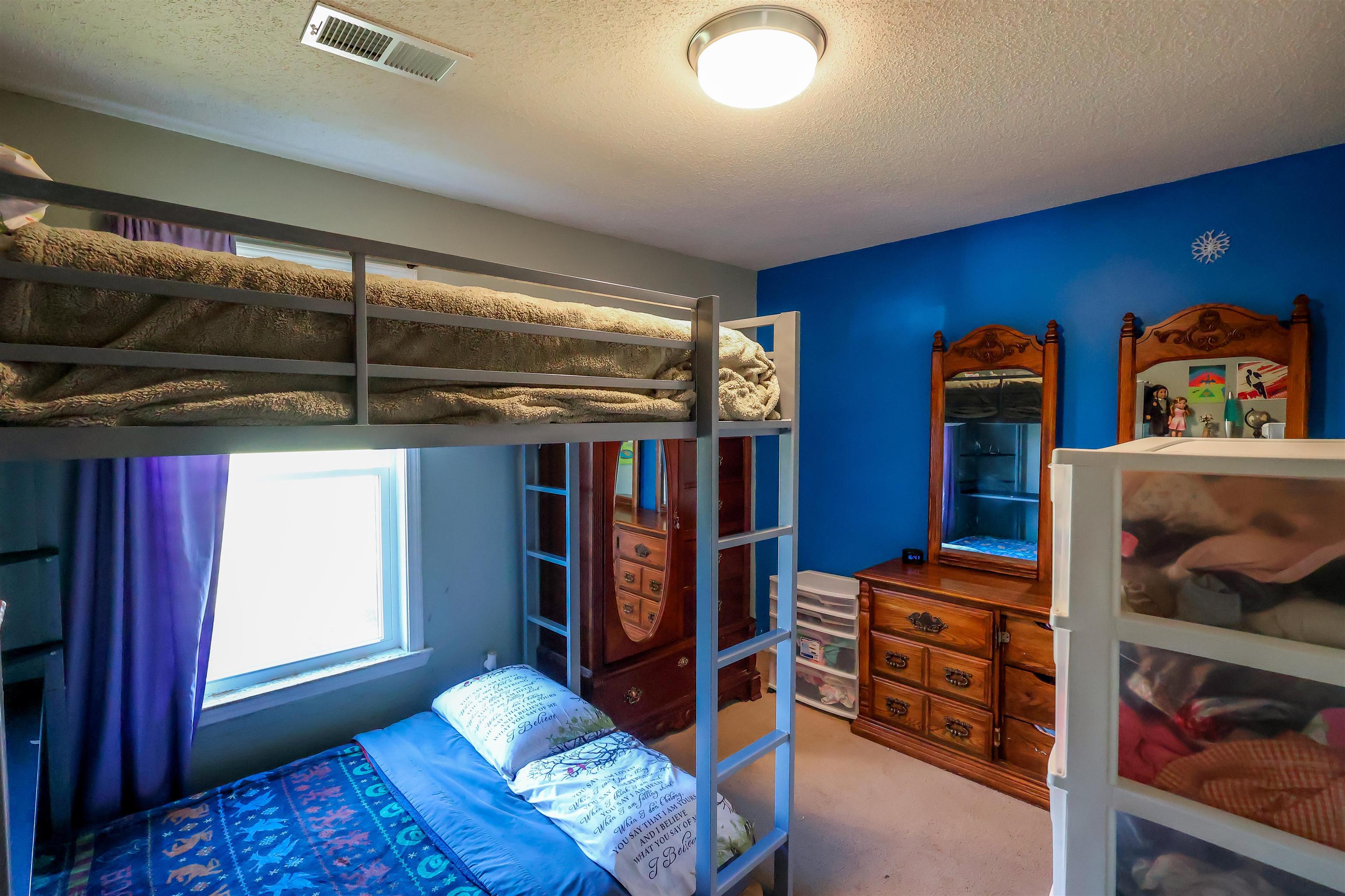 157 Nancye Reeder Avenue Munford, TN 38058 - Photo 17 of 17 a bedroom with furniture and window