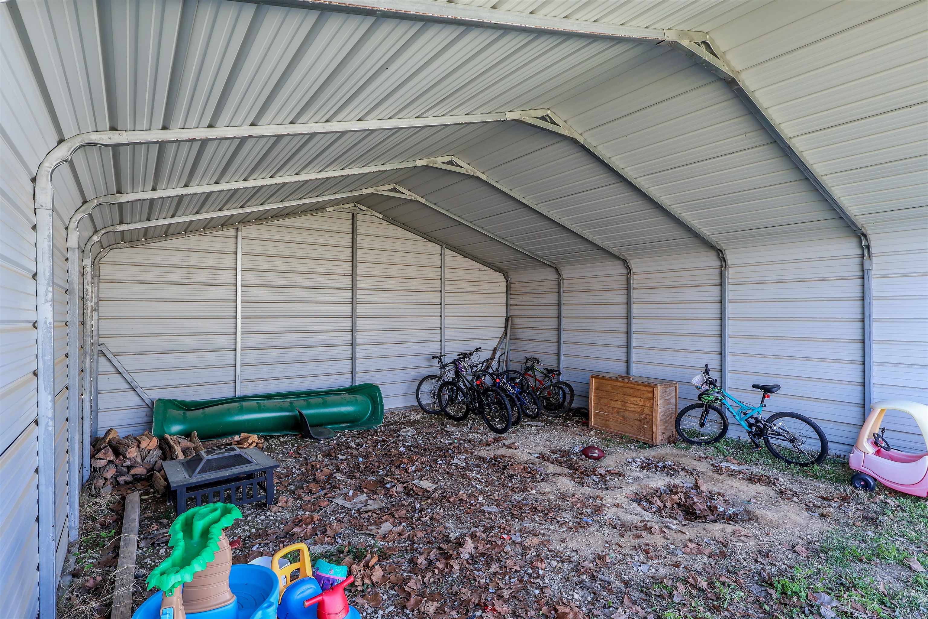 157 Nancye Reeder Avenue Munford, TN 38058 - Photo 5 of 17 a view of a backyard with plants and swing