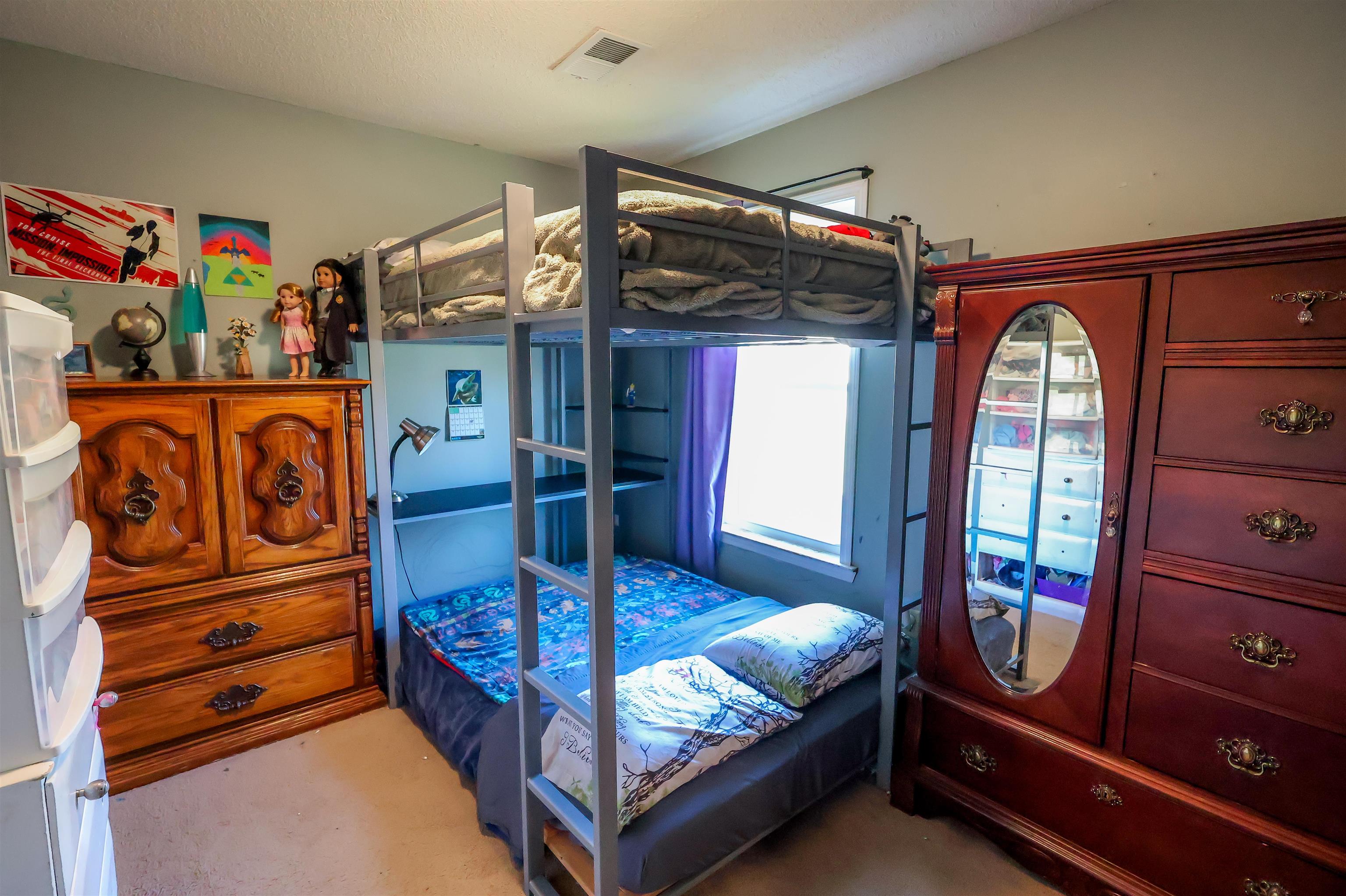 157 Nancye Reeder Avenue Munford, TN 38058 - Photo 7 of 17 a bedroom with a bed and wooden floor