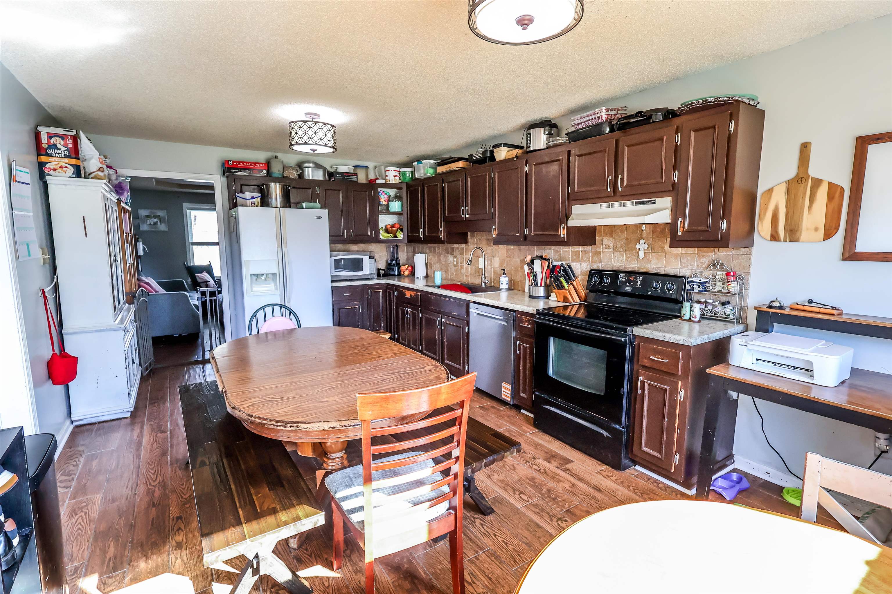157 Nancye Reeder Avenue Munford, TN 38058 - Photo 10 of 17 a kitchen with stainless steel appliances granite countertop a stove top oven a sink dishwasher and cabinets
