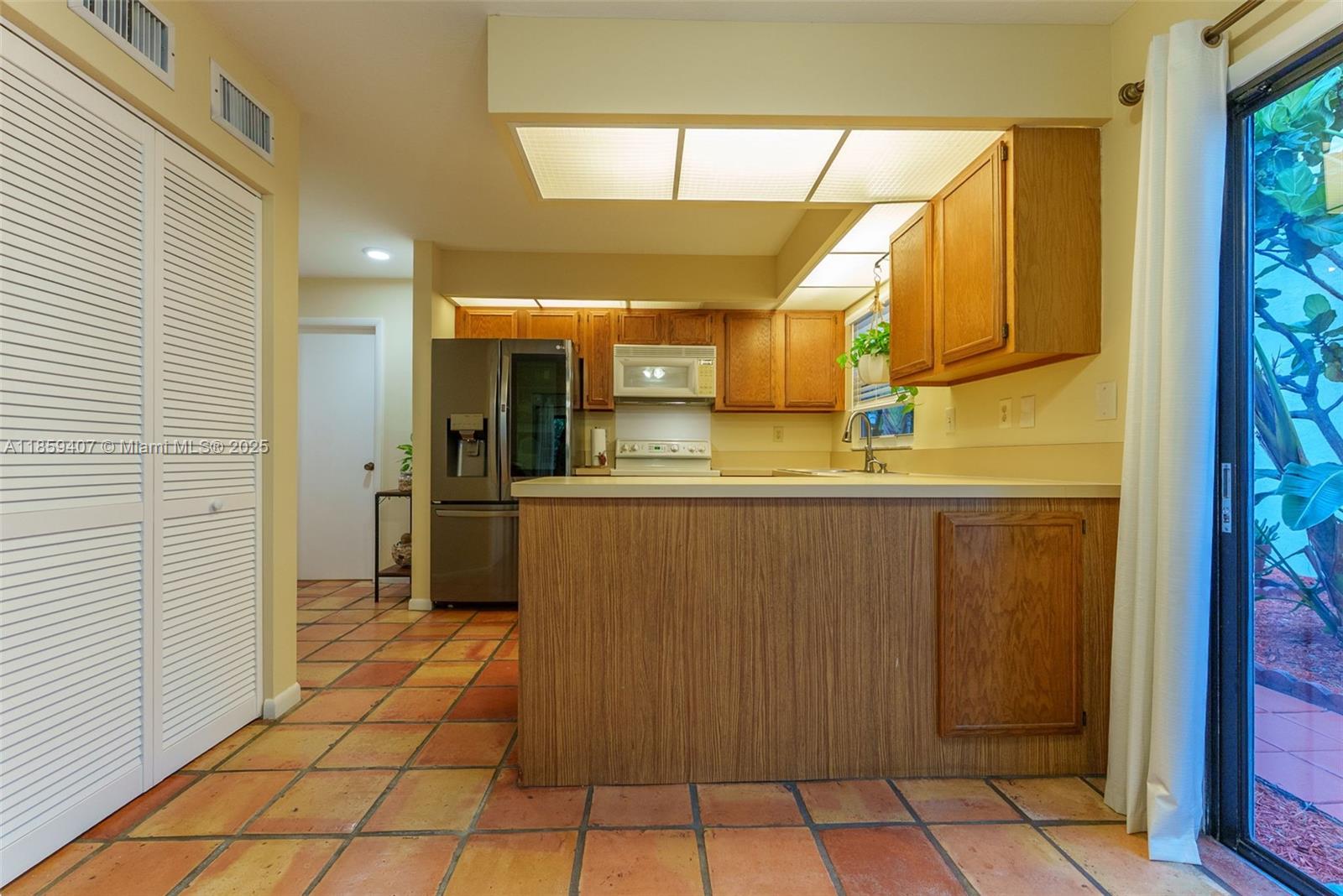 17068 Traverse Circle Jupiter, FL 33477 - Photo 16 of 72 a bathroom with a sink a mirror and a shower