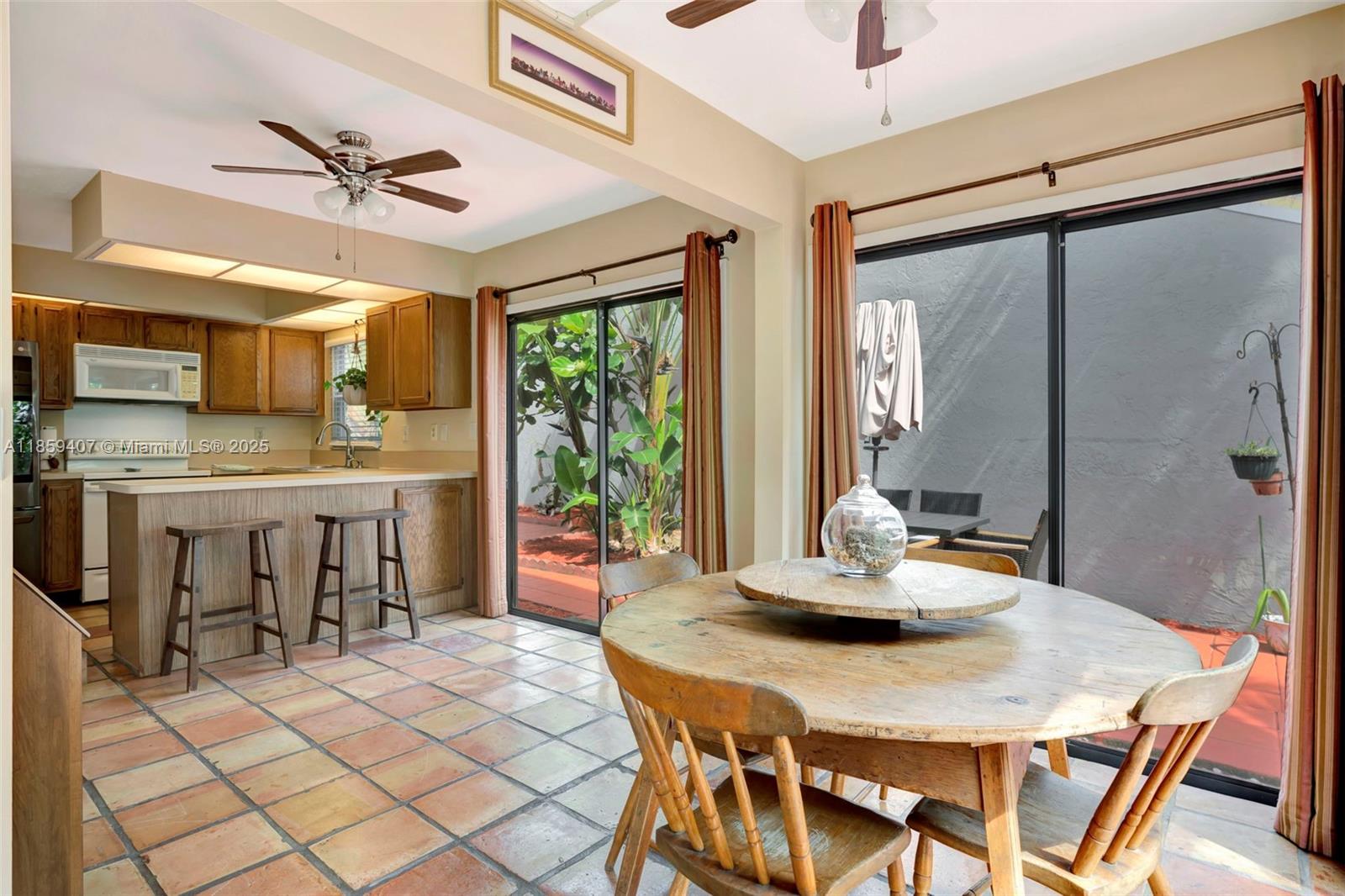 17068 Traverse Circle Jupiter, FL 33477 - Photo 17 of 72 a dining room with a table and chairs