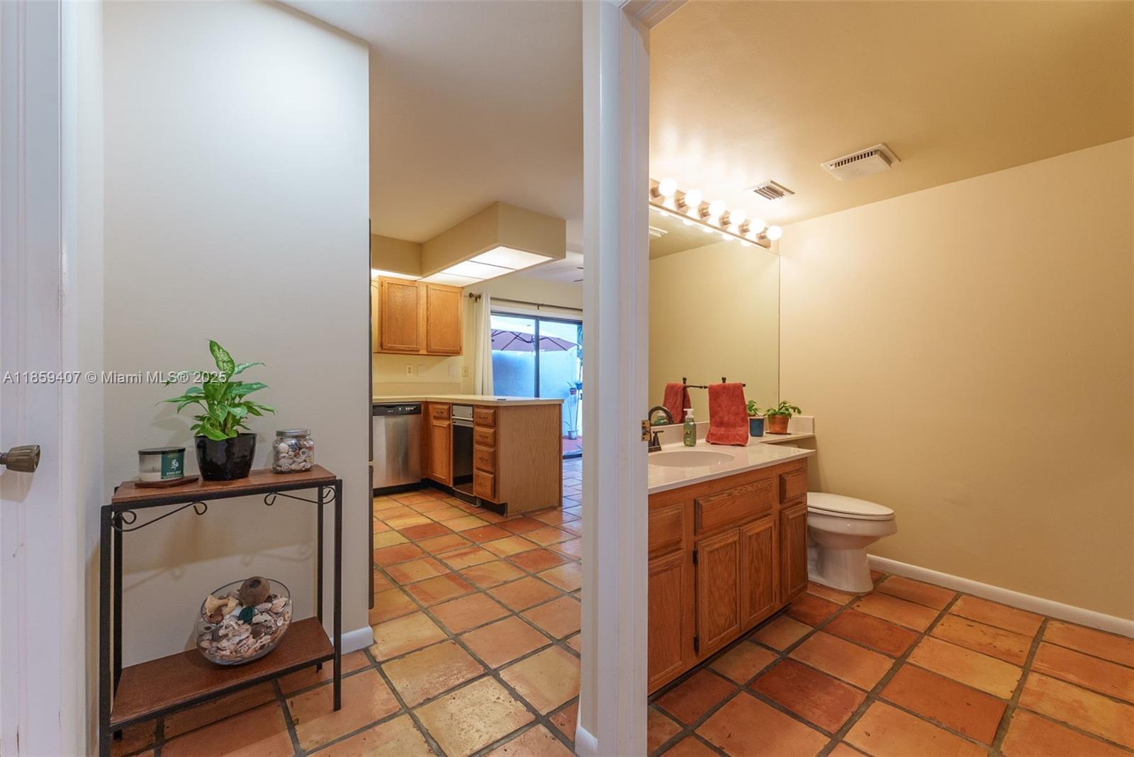 17068 Traverse Circle Jupiter, FL 33477 - Photo 20 of 72 a bathroom with a toilet a sink and mirror