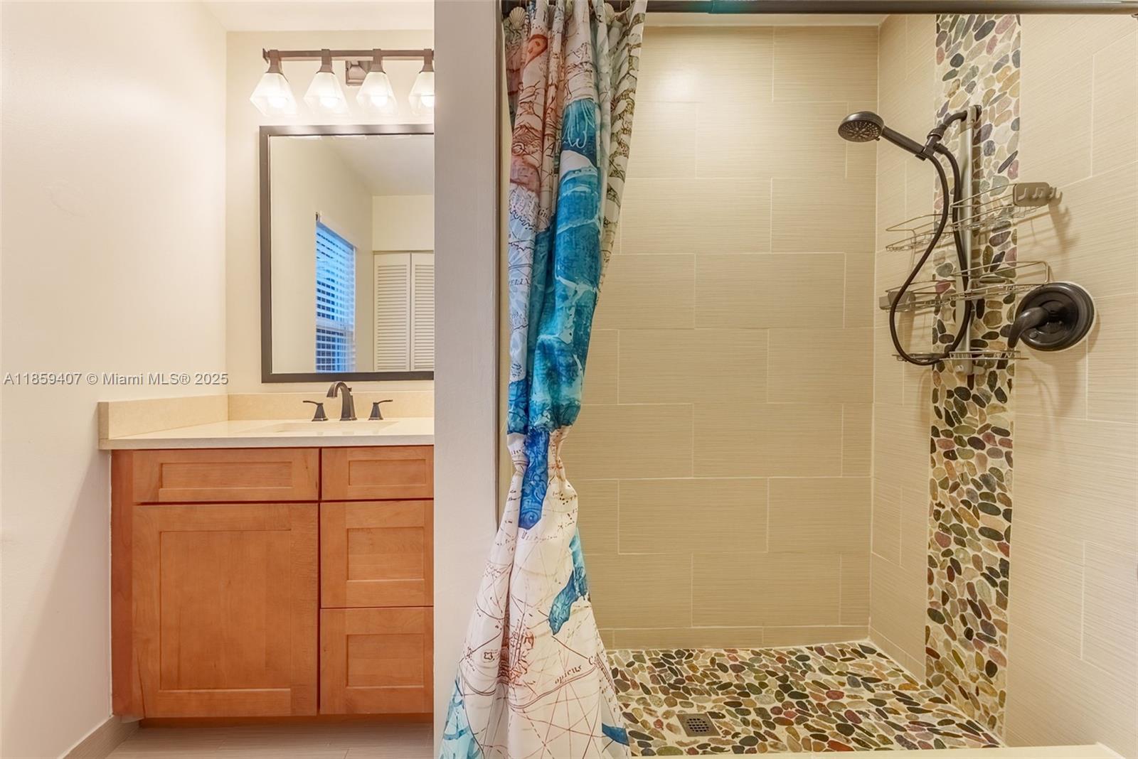 17068 Traverse Circle Jupiter, FL 33477 - Photo 22 of 72 a bathroom with a sink and a mirror
