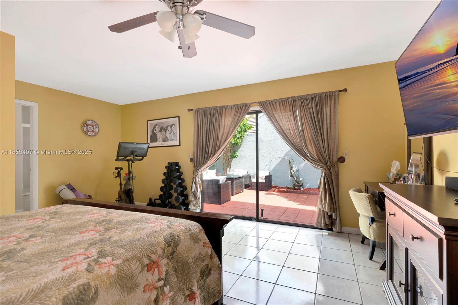17068 Traverse Circle Jupiter, FL 33477 - Photo 23 of 72 a bedroom with a bed and a chandelier