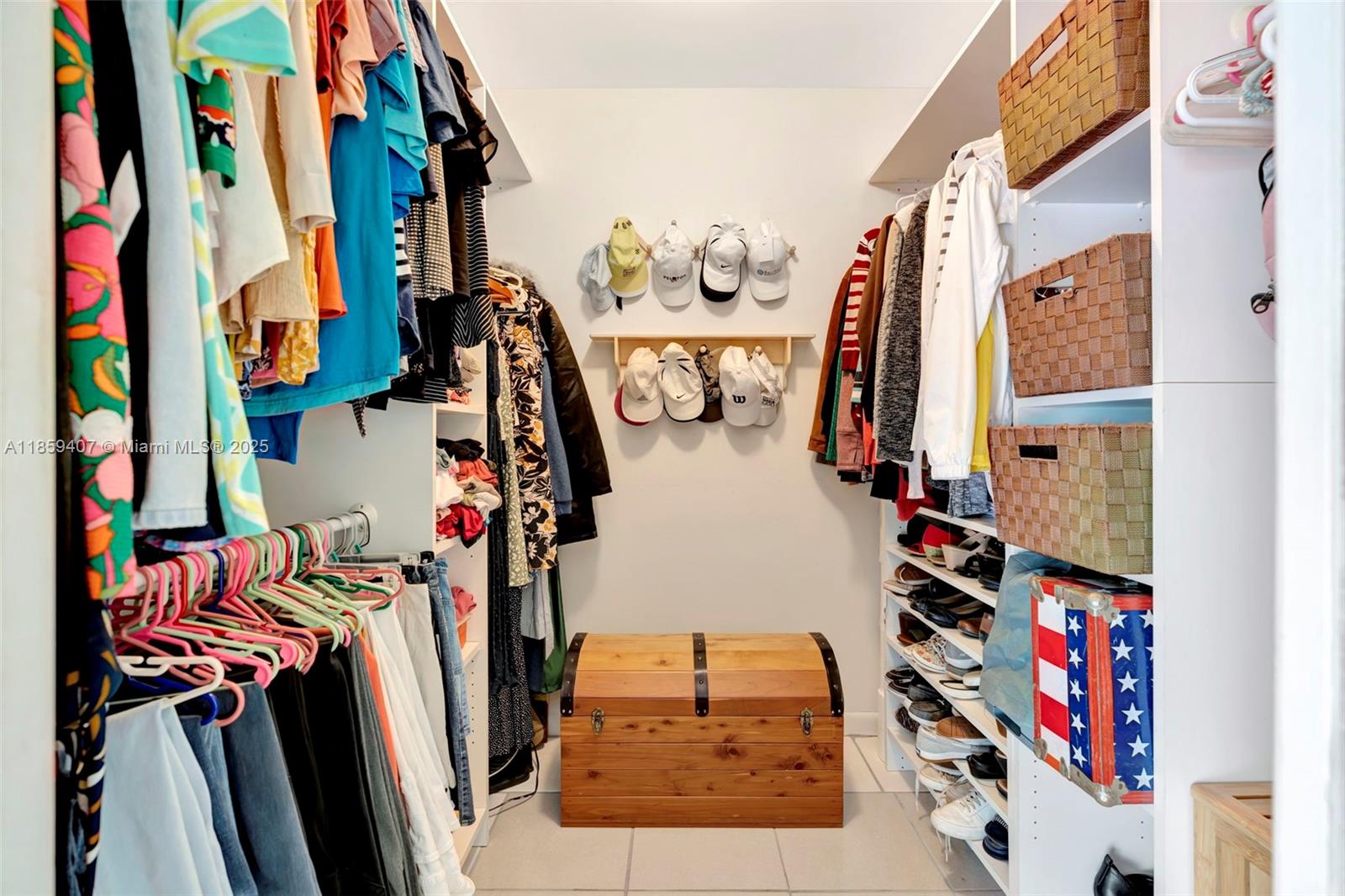 17068 Traverse Circle Jupiter, FL 33477 - Photo 27 of 72 a view of walk in closet with clothes and shoes