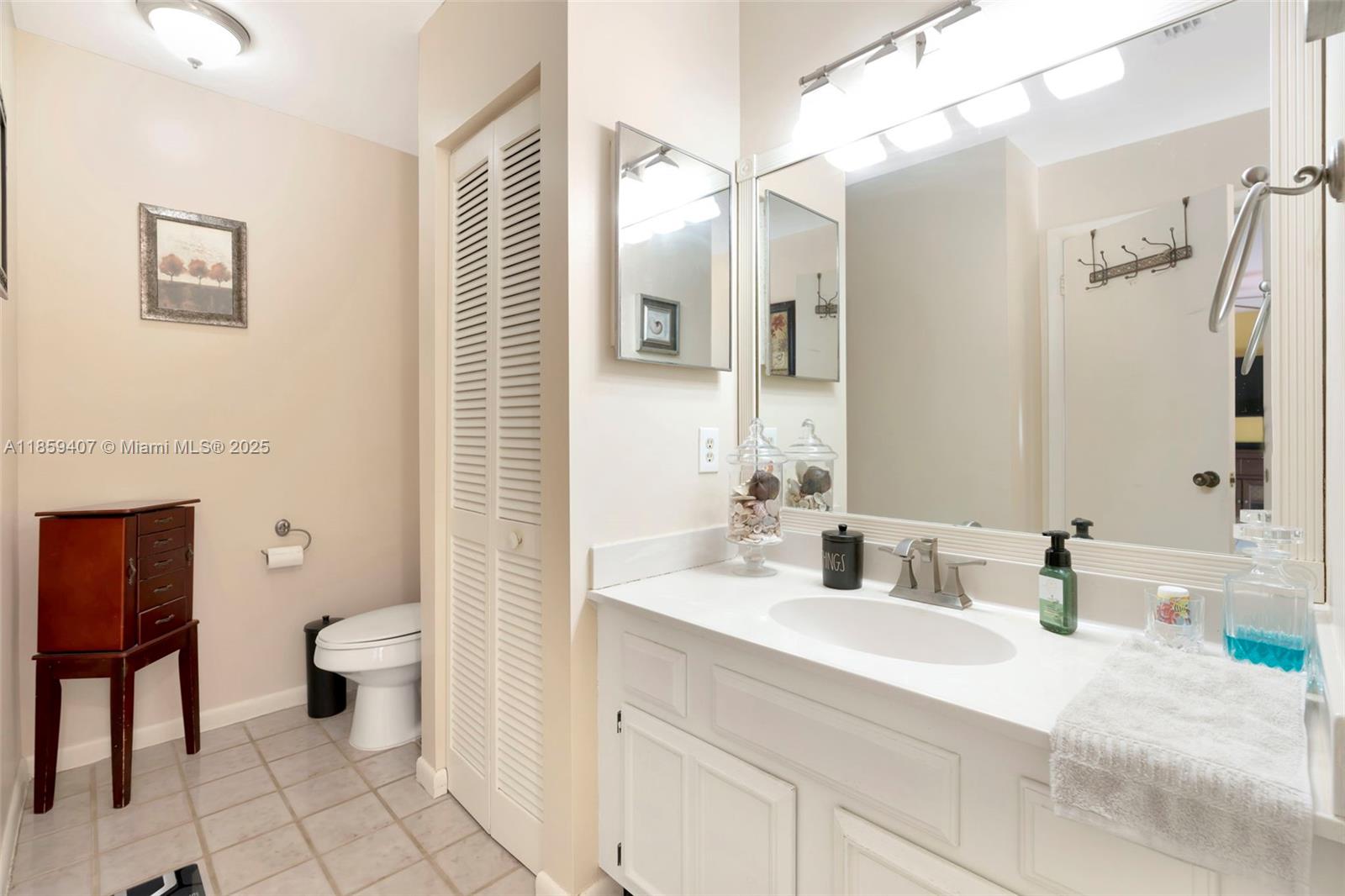 17068 Traverse Circle Jupiter, FL 33477 - Photo 29 of 72 a bathroom with a sink a toilet and shower