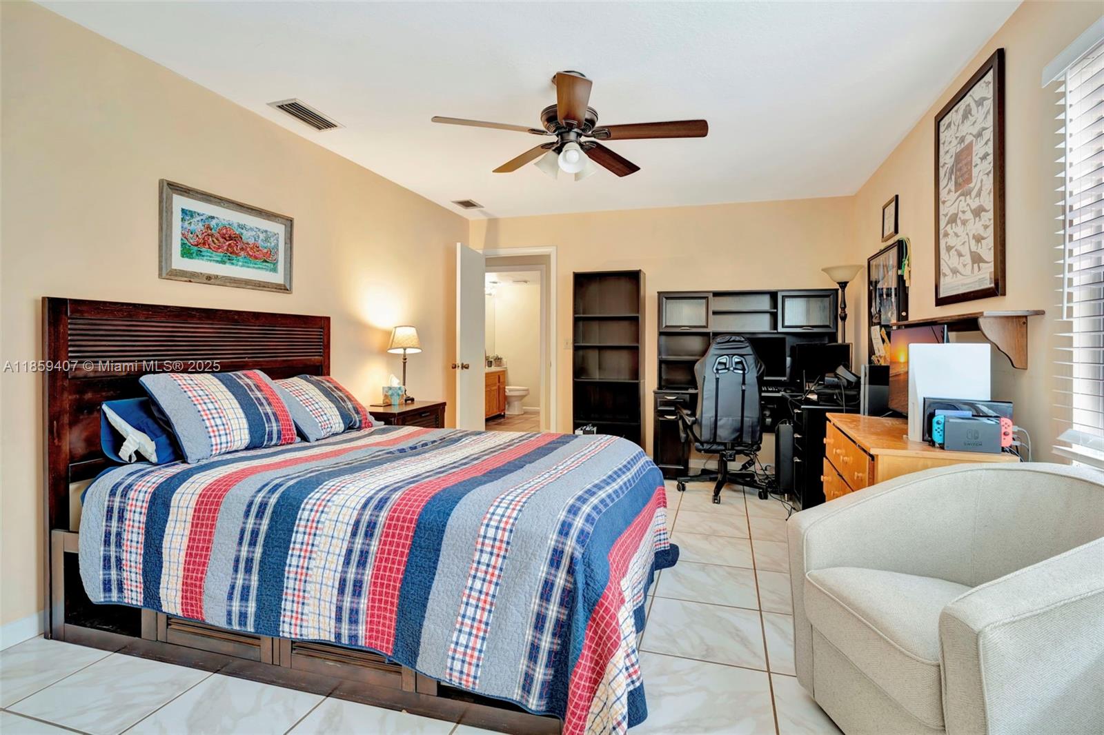 17068 Traverse Circle Jupiter, FL 33477 - Photo 35 of 72 a bed room with a bed and dresser