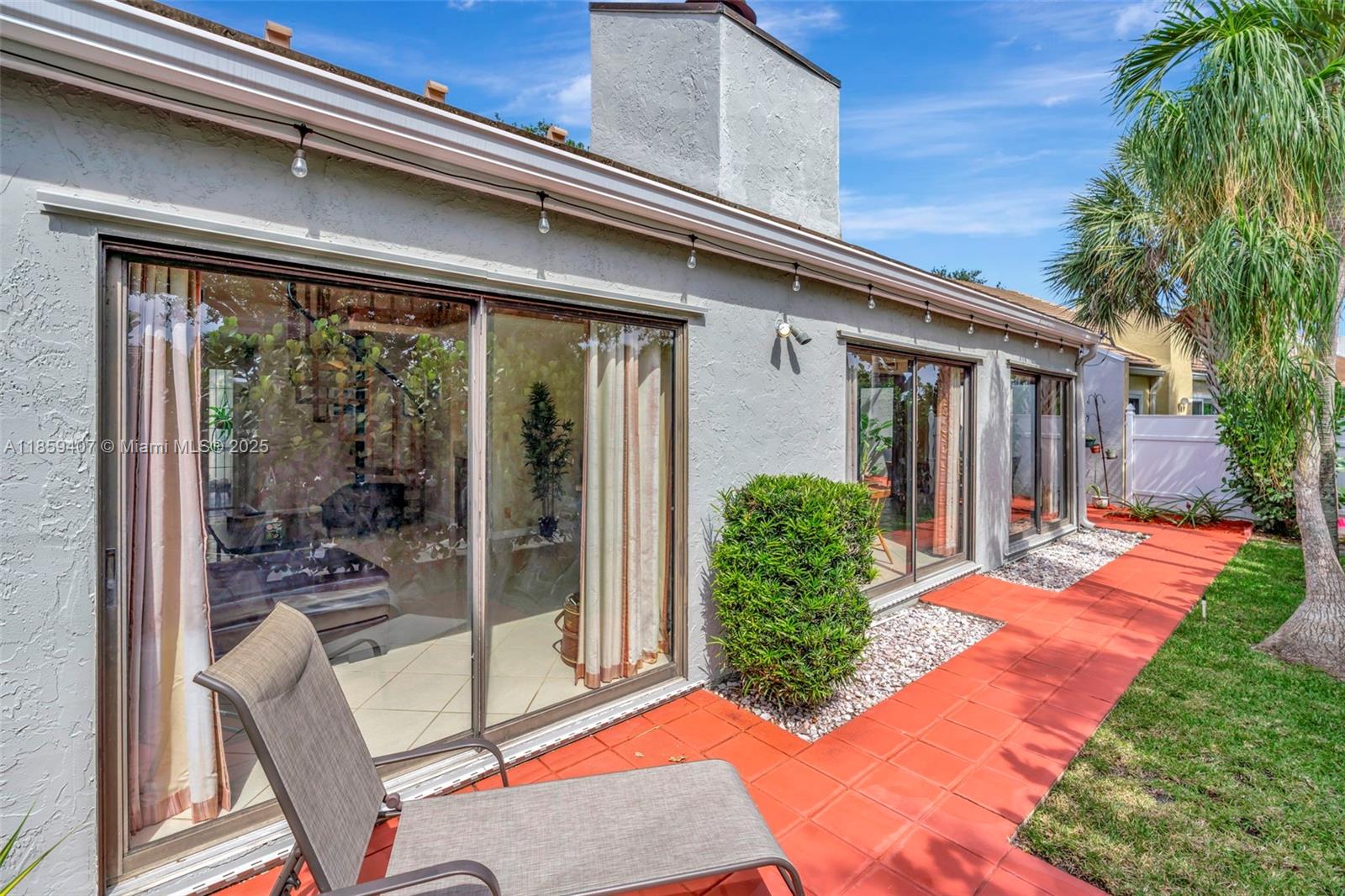 17068 Traverse Circle Jupiter, FL 33477 - Photo 55 of 72 a view of a house with backyard and porch