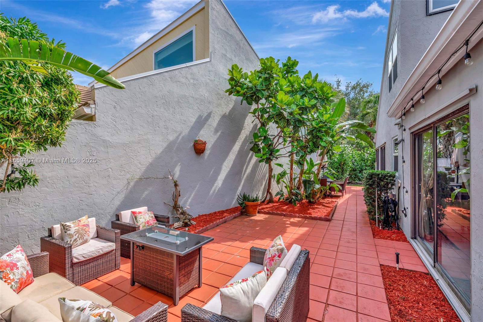 17068 Traverse Circle Jupiter, FL 33477 - Photo 63 of 72 a backyard of a house with seating space