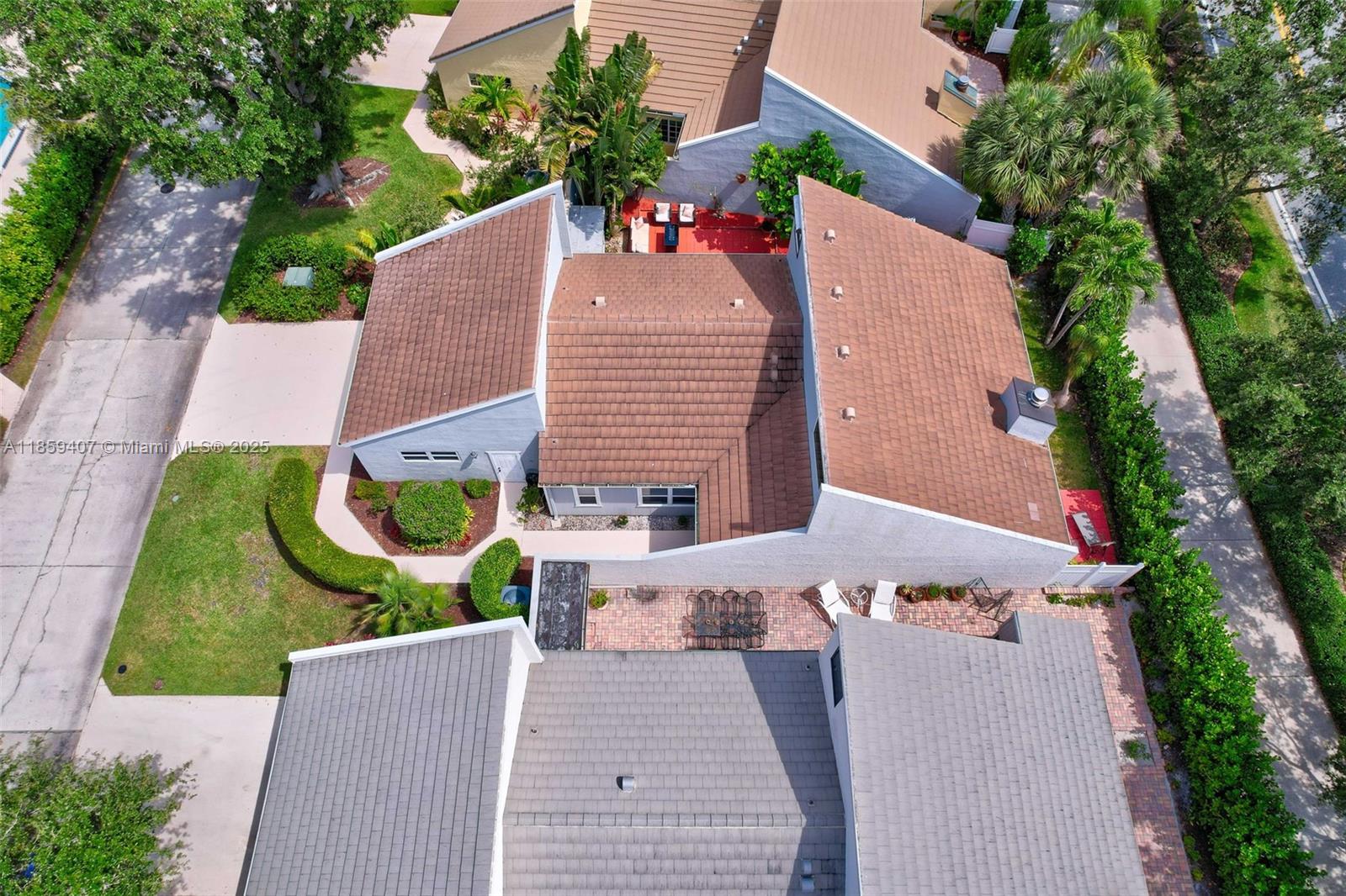 17068 Traverse Circle Jupiter, FL 33477 - Photo 66 of 72 an aerial view of a house with a yard and potted plants