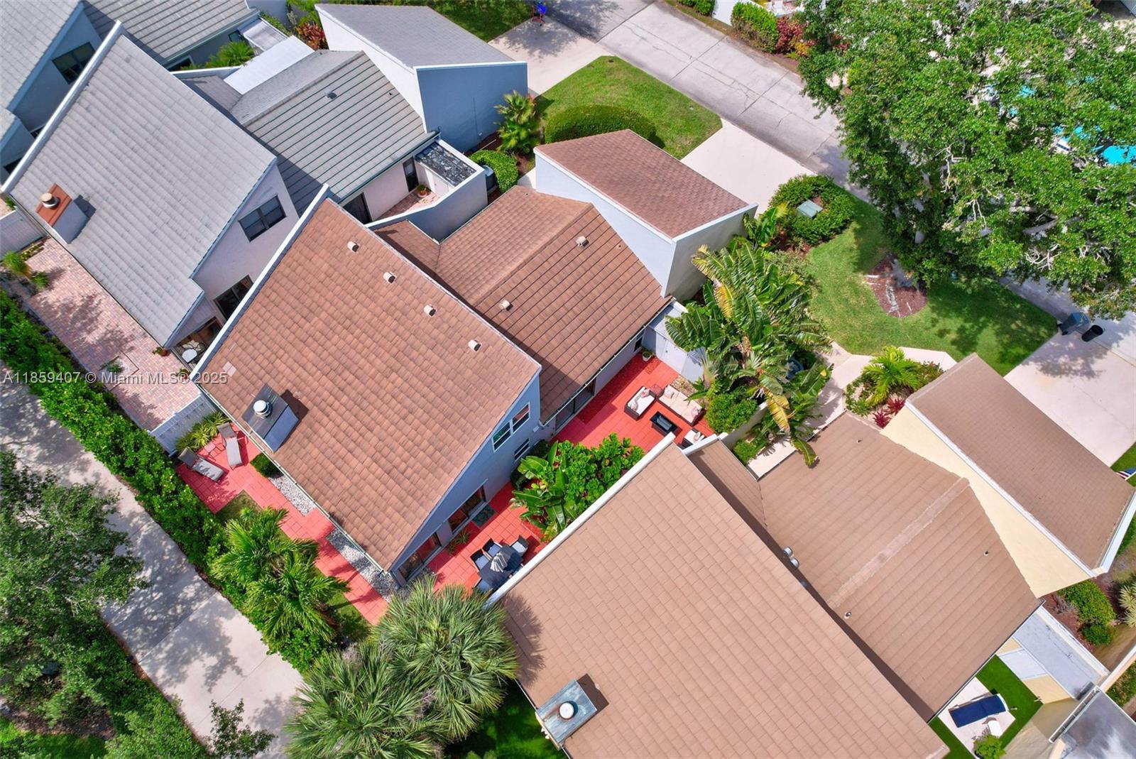 17068 Traverse Circle Jupiter, FL 33477 - Photo 69 of 72 an aerial view of a house with a yard and potted plants