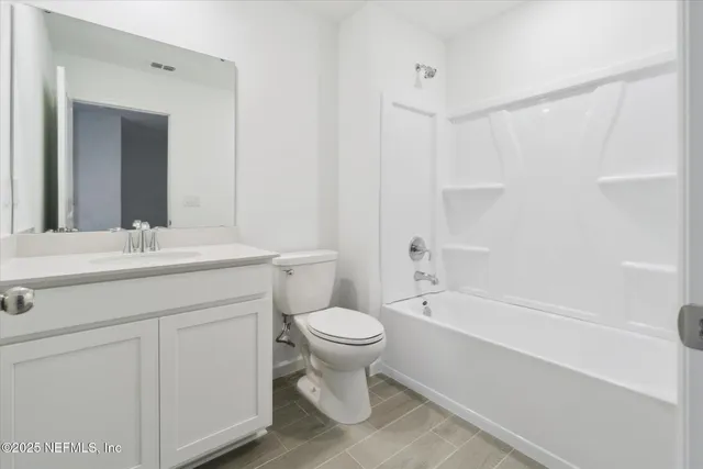 a bathroom with a toilet sink and a bathtub