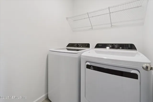 a utility room with dryer and washer