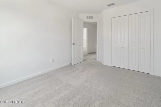 a view of a balcony with lake view and a garden