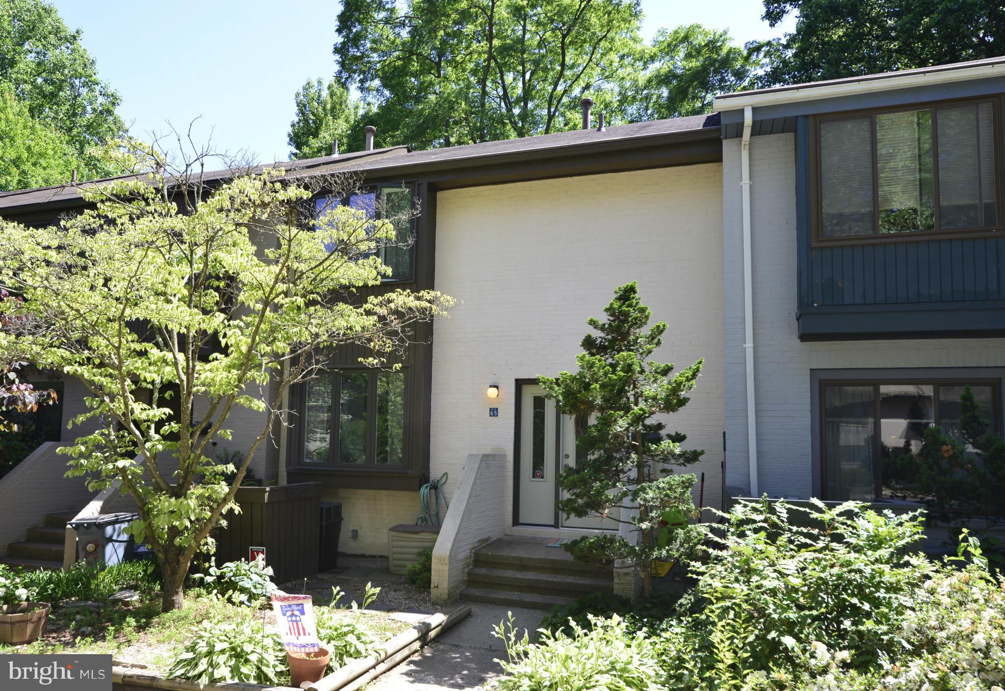 2065 Golf Course Drive Reston, VA 20191 - Photo 1 of 30 a front view of a house with a yard