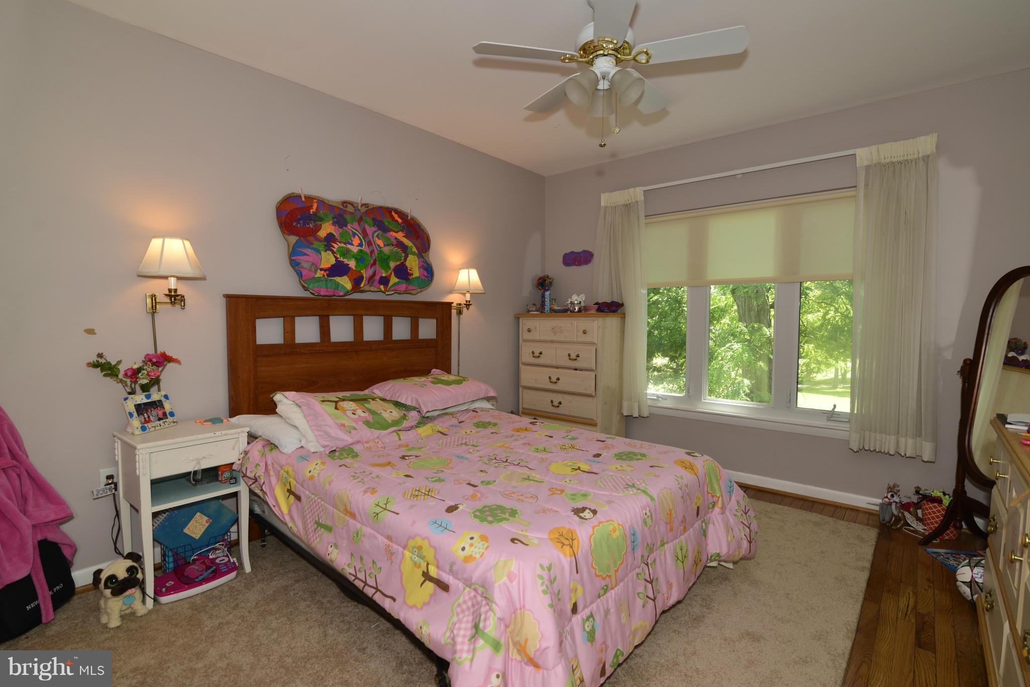 2065 Golf Course Drive Reston, VA 20191 - Photo 18 of 30 a bedroom with a bed a dresser and a window