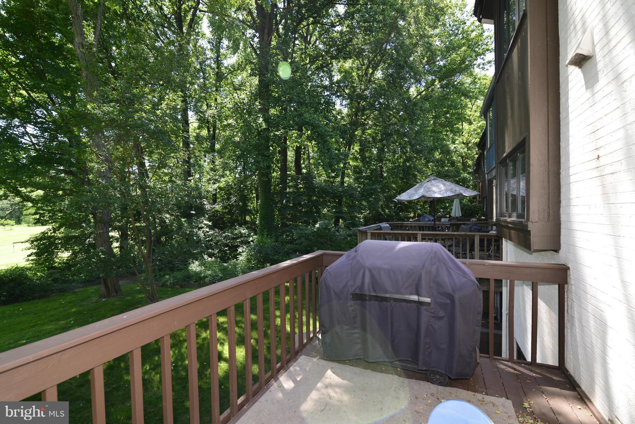 2065 Golf Course Drive Reston, VA 20191 - Photo 23 of 30 a view of backyard with deck and outdoor seating